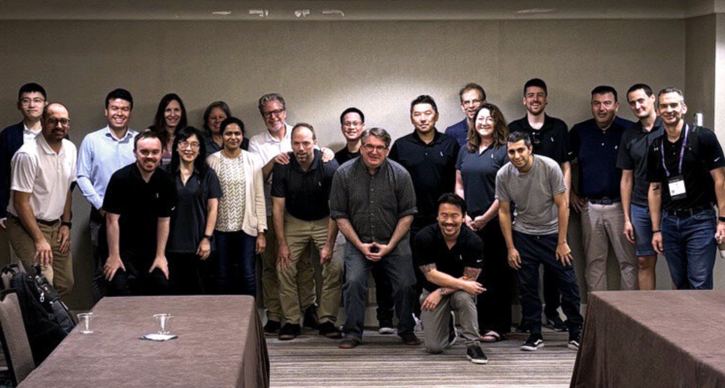 A group of people posing for a photo

Description automatically generated